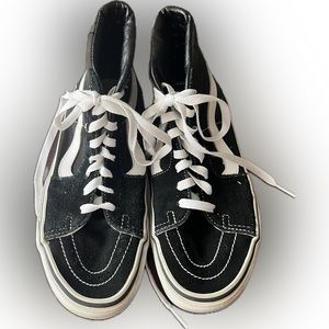 Van’s black and white high top sneakers